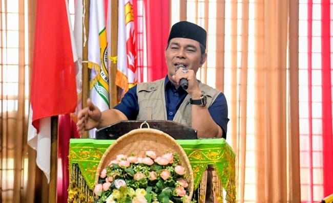 Bupati Aceh Besar, H Muharram Idris menyampaikan sambutan sekaligus membuka Raker KONI Aceh Besar Tahun 2026 di Gedung Dekranasda Aceh Besar, Gampong Gani, Kecamatan Ingin Jaya, Aceh Besar, Sabtu (23/5/2026). FOTO/MC ACEH BESAR