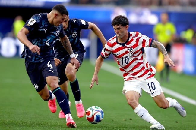 Christian Pulisic dibayangi Juan Jose Caceres dalam pertandingan Piala Dunia FIFA 2026 Grup D antara Amerika Serikat vs Paraguay di Stadion Los Angeles pada 12 Juni 2026 di Los Angeles, California. Dean Mouhtaropoulos/Getty Images/AFP (Foto oleh Dean Mouhtaropoulos / GETTY IMAGES AMERIKA UTARA / Getty Images melalui AFP)(AFP/DEAN MOUHTAROPOULOS) Christian Pulisic dibayangi Juan Jose Caceres dalam pertandingan Piala Dunia FIFA 2026 Grup D antara Amerika Serikat vs Paraguay di Stadion Los Angeles pada 12 Juni 2026 di Los Angeles, California. Dean Mouhtaropoulos/Getty Images/AFP (Foto oleh Dean Mouhtaropoulos / GETTY IMAGES AMERIKA UTARA / Getty Images melalui AFP)(AFP/DEAN MOUHTAROPOULOS)