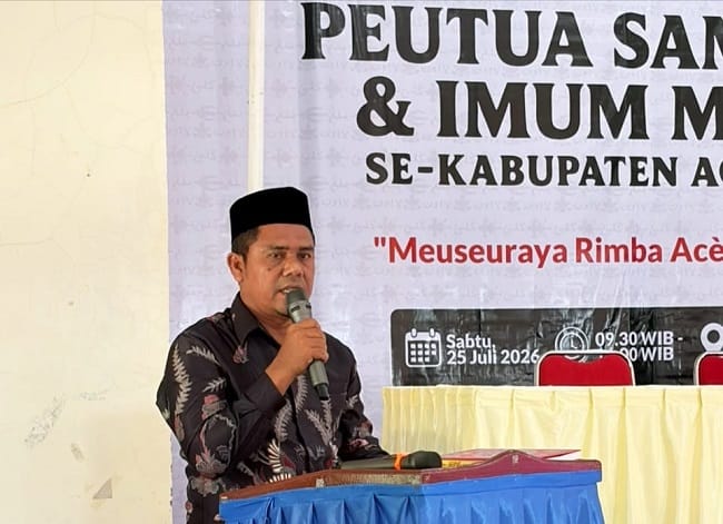 Staf Ahli Bupati Aceh Besar Bidang Keistimewaan Aceh, SDM, dan Kerja Sama, Abubakar, S.Ag, membuka kegiatan Pra Duek Pakat Mukim, Pawang Glee, dan Sambinoe di Aula UDKP Kecamatan Lhoknga, Aceh Besar, Sabtu (25/7/2026). FOTO/MC ACEH BESAR Staf Ahli Bupati Aceh Besar Bidang Keistimewaan Aceh, SDM, dan Kerja Sama, Abubakar, S.Ag, membuka kegiatan Pra Duek Pakat Mukim, Pawang Glee, dan Sambinoe di Aula UDKP Kecamatan Lhoknga, Aceh Besar, Sabtu (25/7/2026). FOTO/MC ACEH BESAR