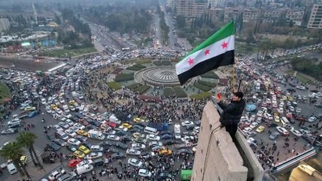 Ilustrasi bendera Suriah (Foto: AFP/BAKR ALKASEM)